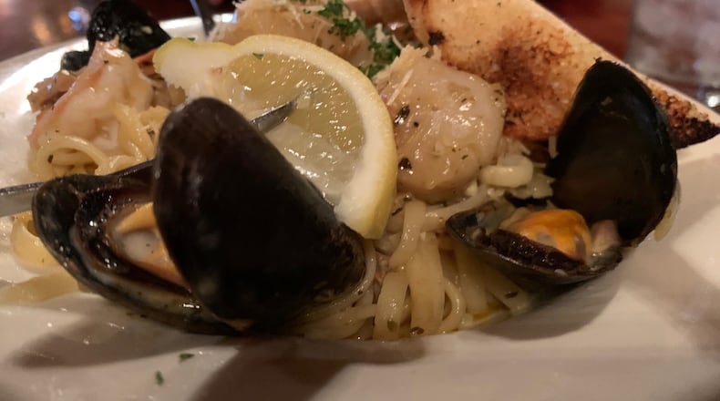 Jay’s Linguine al Frutti di Mal is tossed with shrimp, scallops, mussels and chopped clams in a white wine garlic butter sauce topped with Parmesan cheese. Pictured is the lunch portion. CONTRIBUTED/ALEXIS LARSEN