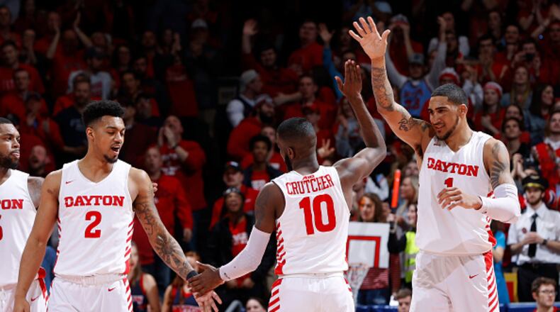 DAYTON, OH - MARCH 07: Obi Toppin #1, Jalen Crutcher #10 and Ibi Watson #2 of the Dayton Flyers celebrate against the George Washington Colonials in the second half of a game at UD Arena on March 7, 2020 in Dayton, Ohio. Dayton defeated George Washington 76-51. (Photo by Joe Robbins/Getty Images)