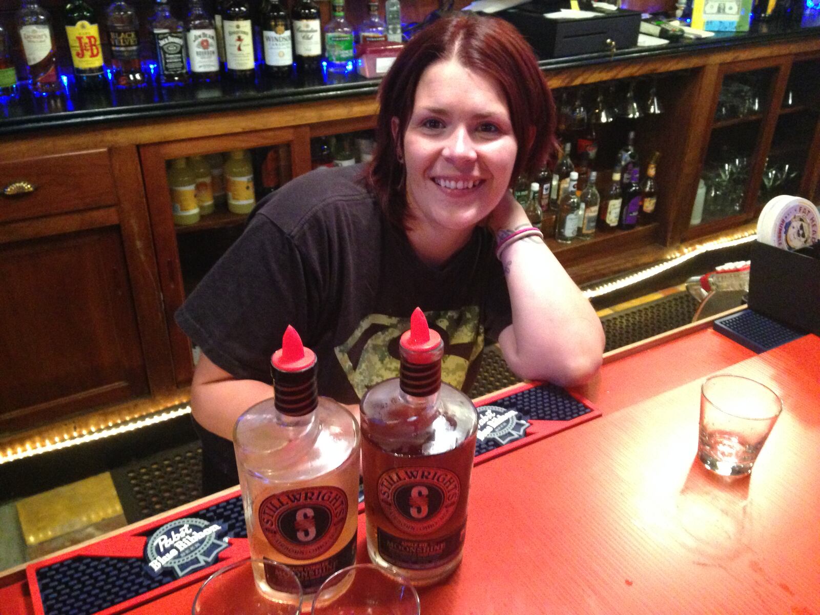 Riff Raff Tavern on the Canal, 130 N. Patterson Blvd. in Dayton, is among the bars that serve Stillwrights Moonshine from Flat Rock Spirits Distillery in Fairborn. (Staff photo by Amelia Robinson) Patriots fan Ken-Yon “Party” Hardy and Cincinnati Bengals enthusiast Josh “The …
