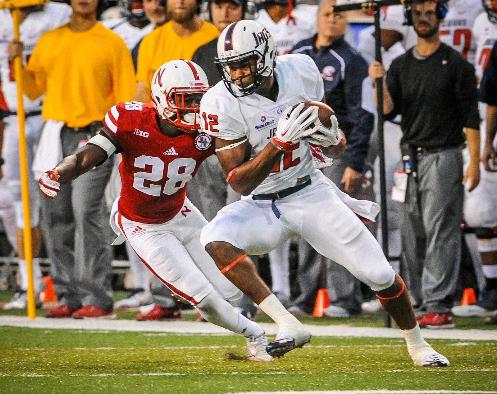 LINCOLN, NE - SEPTEMBER 12: Tight end Gerald Everett #12 of the South Alabama Jaguars tries to elude defensive back Byerson Cockrell #28 of the Nebraska Cornhuskers during their game at Memorial Stadium on September 12, 2015 in Lincoln, Nebraska. (Photo by Eric Francis/Getty Images)