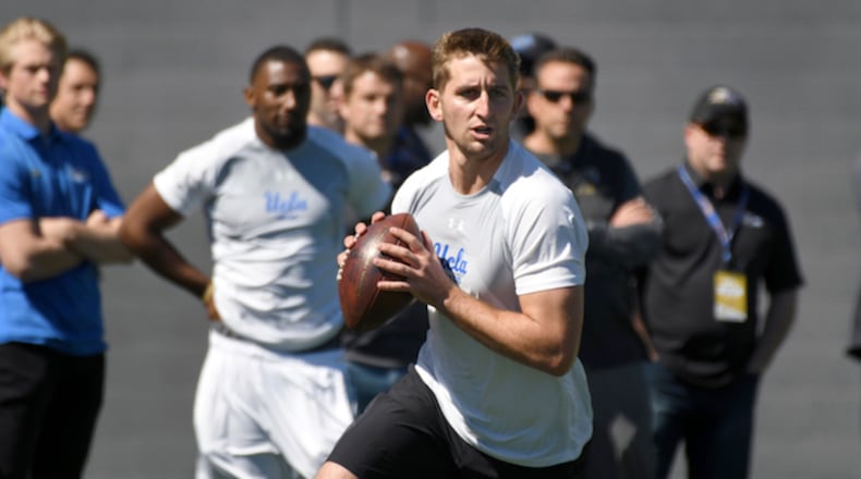 UCLA quarterback Josh Rosen rolls out during UCLA's pro day for NFL draft prospects in Los Angeles, Thursday, March 15, 2018. (AP Photo/Michael Owen Baker)