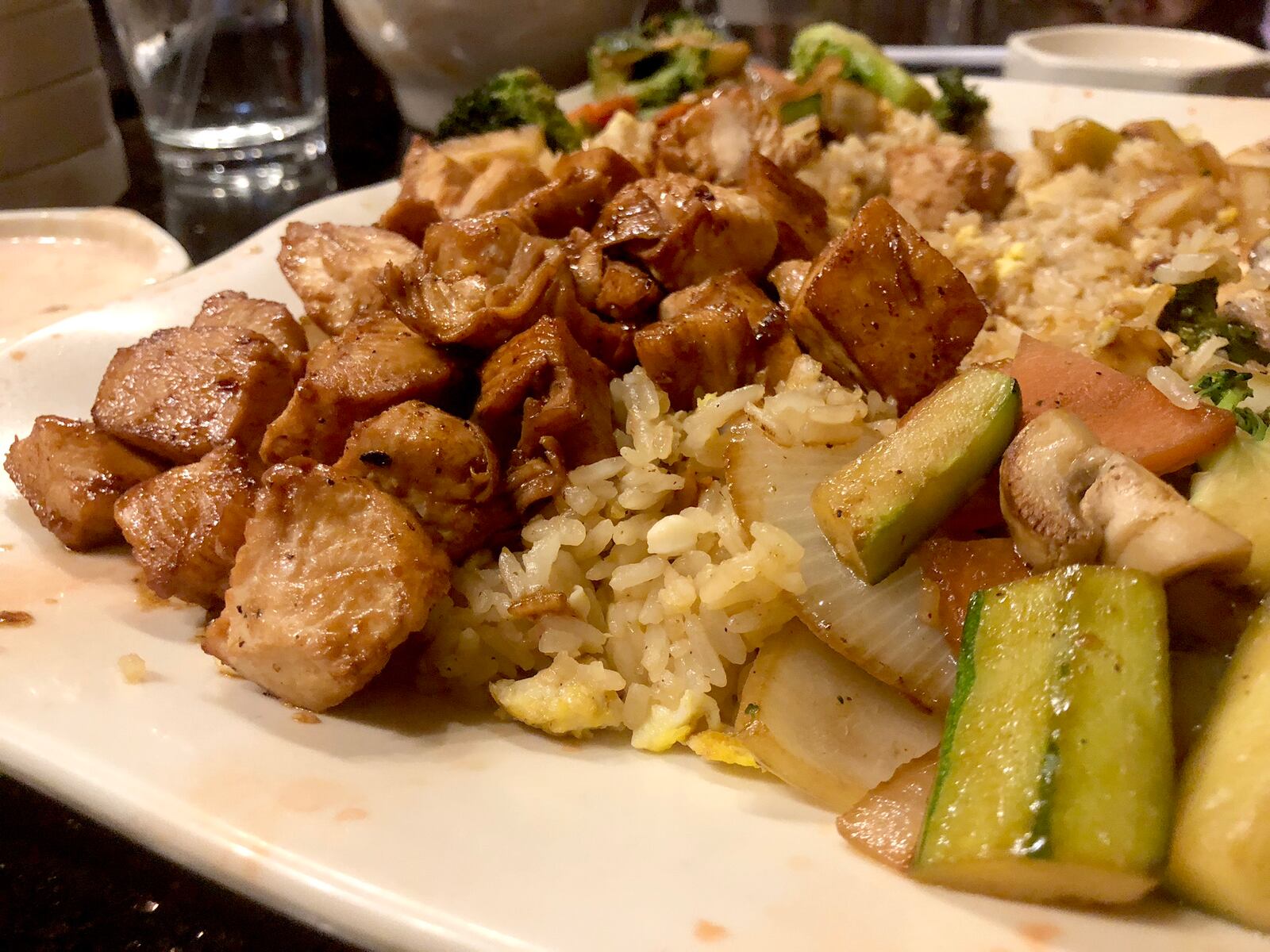 Dinner is the show at Osaka Japanese Steakhouse in Beavercreek near Dayton. The restaurant's  dinning room has several hibachi tables. Sushi and other Japanese favors are on the menu.  The walls are covered in hundreds of photos of customers celebrating anniversaries and birthdays.