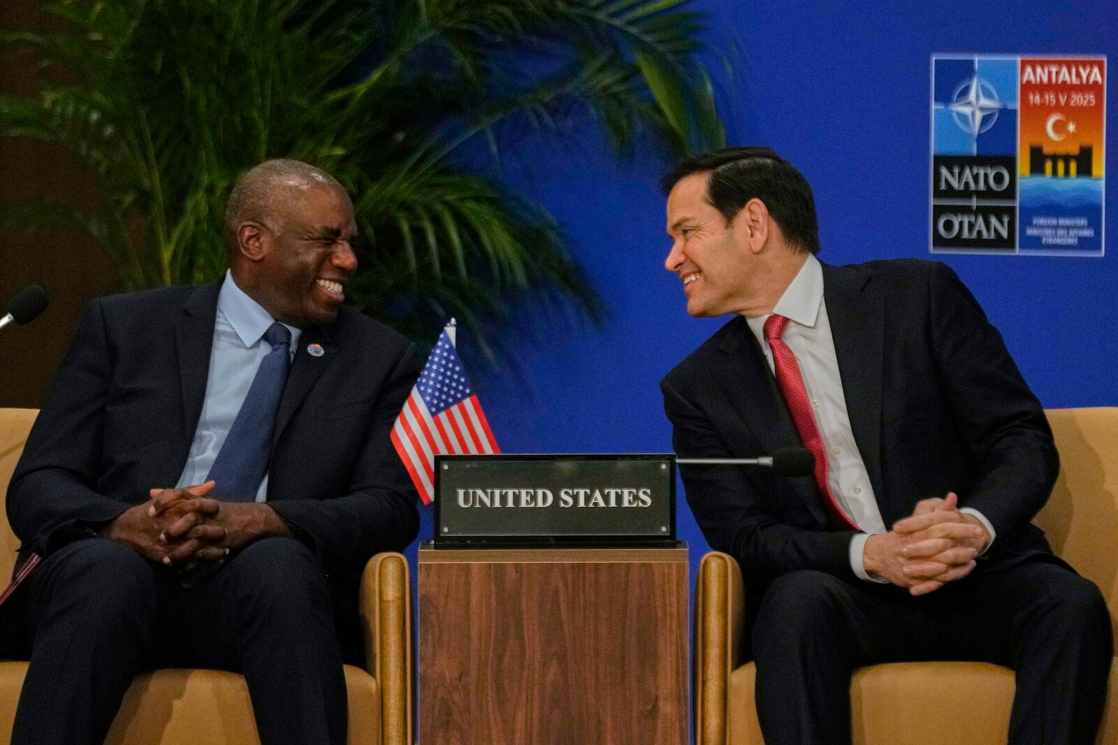 United States Secretary of State Marco Rubio, right, talks to British Foreign Secretary David Lammy during an informal meeting of NATO's foreign ministers in Antalya, southern Turkey, Thursday, May 15, 2025. (AP Photo/Khalil Hamra)