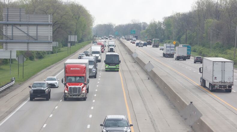 Vehicles travel on Interstate 70 on Friday morning April 25, 2025, after the eastbound side of the highway opened back up. There was a fatal car crash earlier near the Mad River. JOSEPH COOKE/STAFF