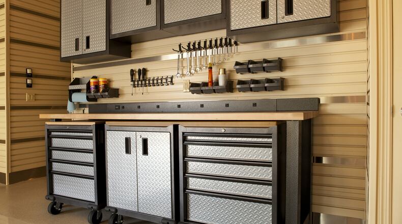 Cabinets offer a neat and simple solution for garage storage. (Dreamstime)