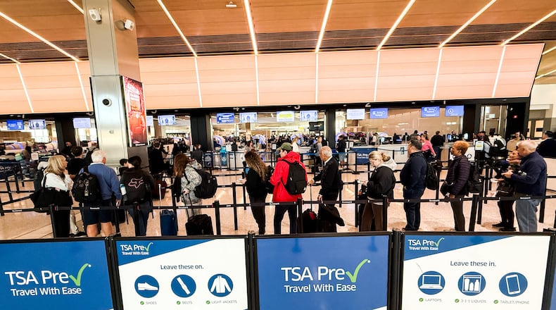 People wait in a TSA security line at Terminal A of Newark Liberty International Airport (EWR) in Newark, N.J., U.S., Tuesday, March 24, 2026. (AP Photo/Eduardo Munoz Alvarez)