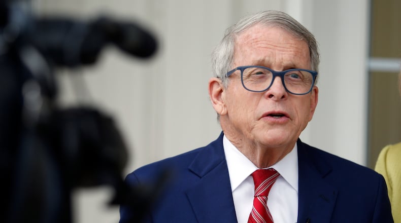 Ohio Gov. Mike DeWine talks with reporters outside of his polling place after voting in Cedarville, Ohio, Tuesday, May 3, 2022. (AP Photo/Paul Vernon)