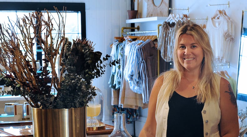 Leslie Moss is the owner of Shoppe Smitten, which is slated to open in Uptown Centerville Thursday., May 23, 2024. The women’s boutique will feature a variety of clothing, home decor, jewelry, accessories and gift items. MARSHALL GORBY/STAFF