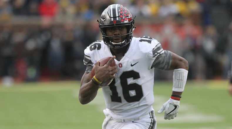 Ohio State’s J.T. Barrett runs for a touchdown against Michigan on Saturday, Nov. 25, 2017, at Michigan Stadium in Ann Arbor, Mich. David Jablonski/Staff