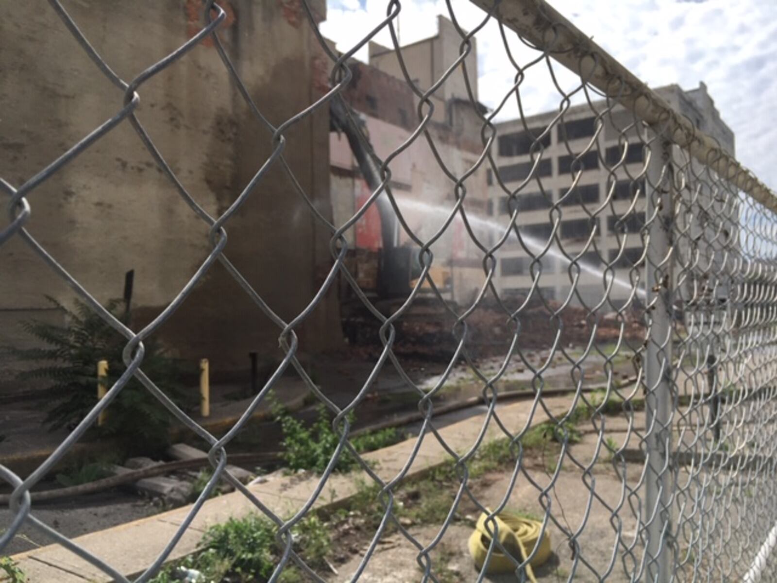 Demolition work at 20 W. Fifth St. Monday, adjacent to the Reed-Steffan building at 18 W. Fifth. THOMAS GNAU/STAFF