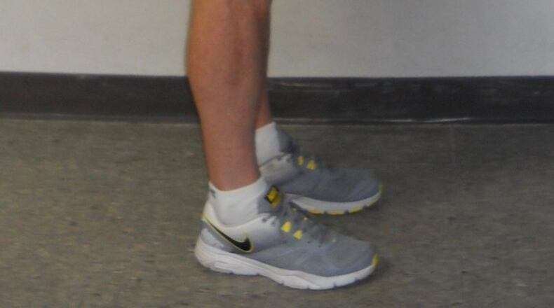 Deadlift with dumbbells: First, hold dumbbells at arm’s length. CONTRIBUTED