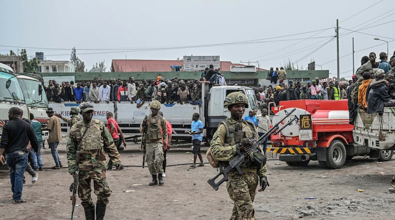 FILE - M23 rebels escort government soldiers and police who surrendered to an undisclosed location in Goma, Democratic republic of the Congo, Jan. 30, 2025. (AP Photo/Moses Sawasawa, File)