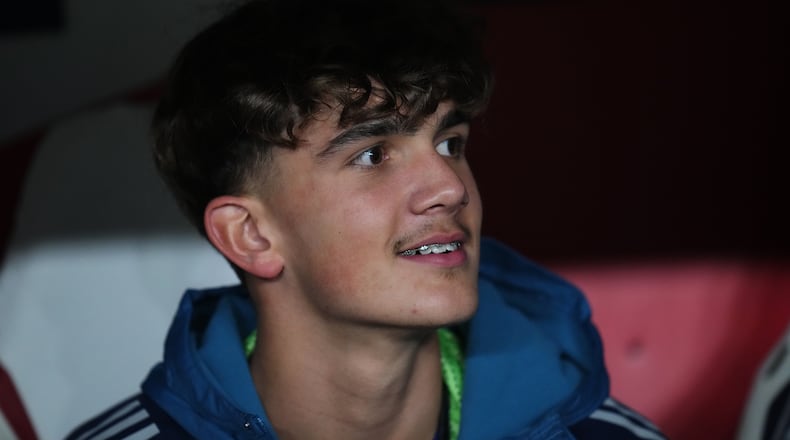 Arsenal's Max Dowman sits on the bench prior to the Champions League opening phase soccer match between Slavia Prague and Arsenal in Prague, Czech Republic, Tuesday, Nov. 4, 2025. (AP Photo/Petr David Josek)