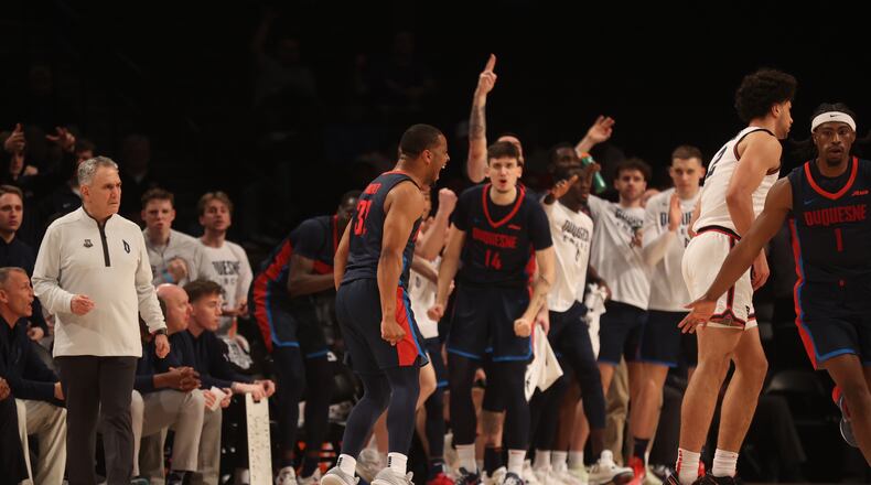 Duquesne's Kareem Rozier celebrates after making a 3-pointer in the Atlantic 10 Conference tournament quarterfinals on Thursday, March 14, 2024, at the Barclays Center in Brooklyn, N.Y. David Jablonski/Staff