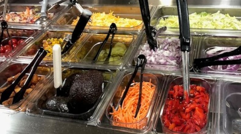 The condiment bar at Flyby BBQ at the Mall at Fairfield Commons in Beavercreek, which announced today it would temporarily close its dining room and focus on delivery and pickup to limit its employees' potential exposure to the Coronavirus.