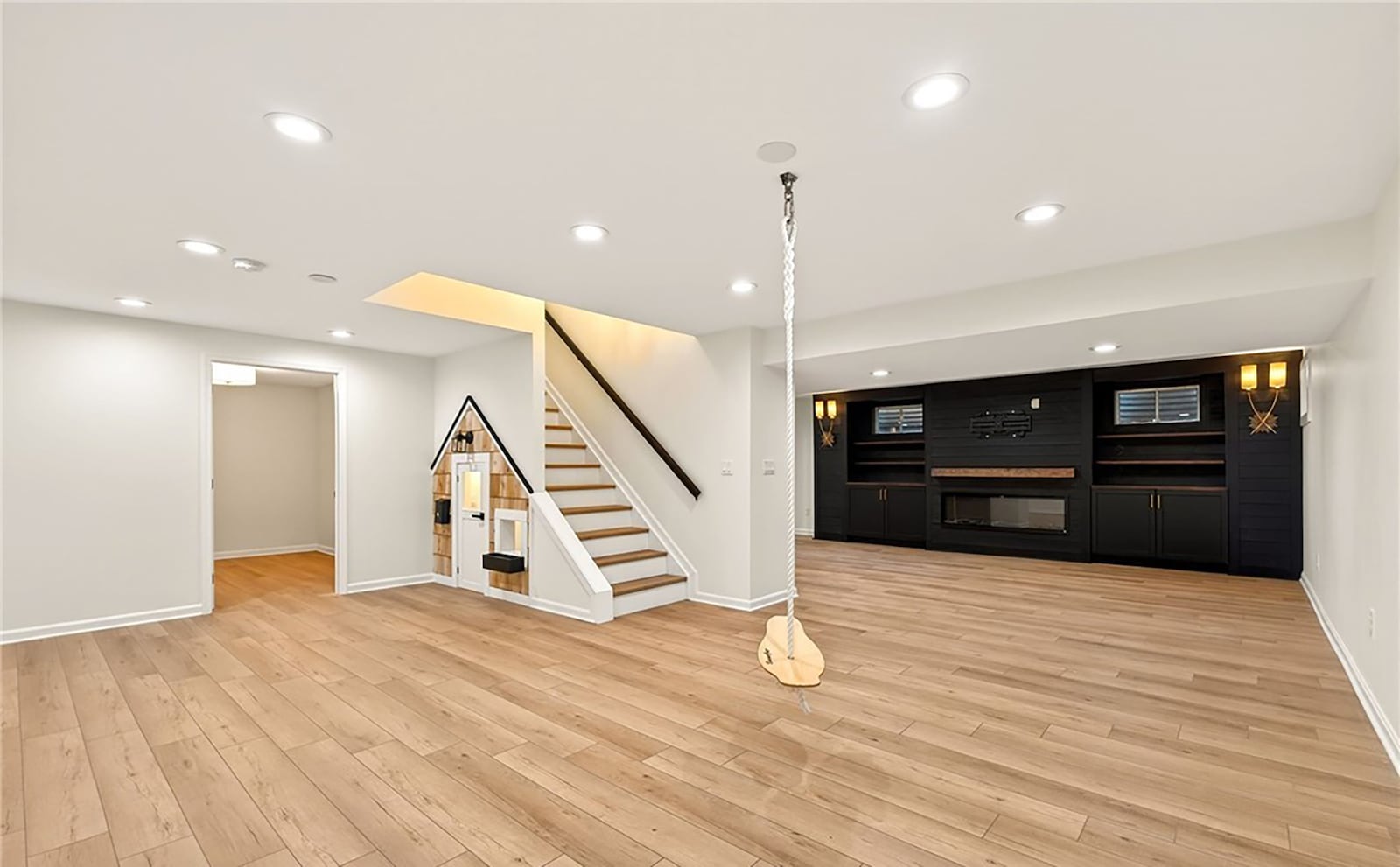 The finished basement features a recreation room with a built in entertainment center and fireplace, a custom playhouse, a wet bar, exercise room, flex room and bathroom. CONTRIBUTED