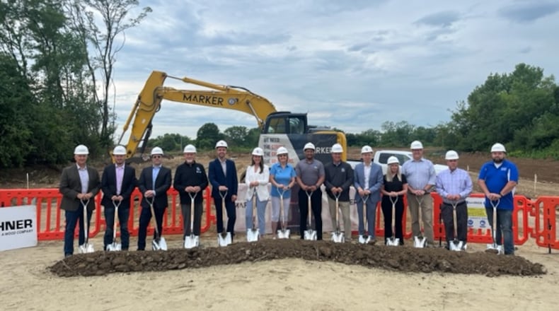 Stakeholders and city officials mark the beginning of construction of a new apartment complex in Huber Heights. CONTRIBUTED