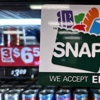 FILE - SNAP EBT information sign is displayed at a gas station in Riverwoods, Ill., Saturday, Nov. 1, 2025. (AP Photo/Nam Y. Huh, file)