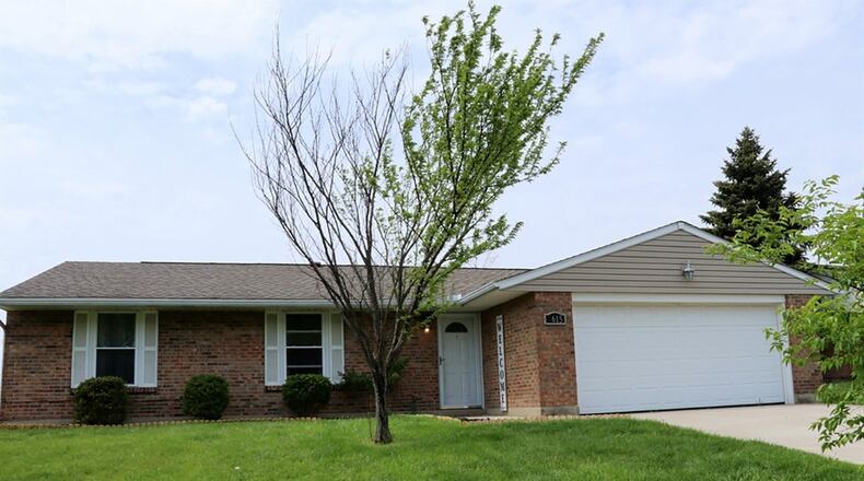 The 3-bedroom brick ranch, which includes about 1,340 sq. ft. of living space, has laminate wood flooring throughout the main social areas CONTRIBUTED PHOTOS BY KATHY TYLER
