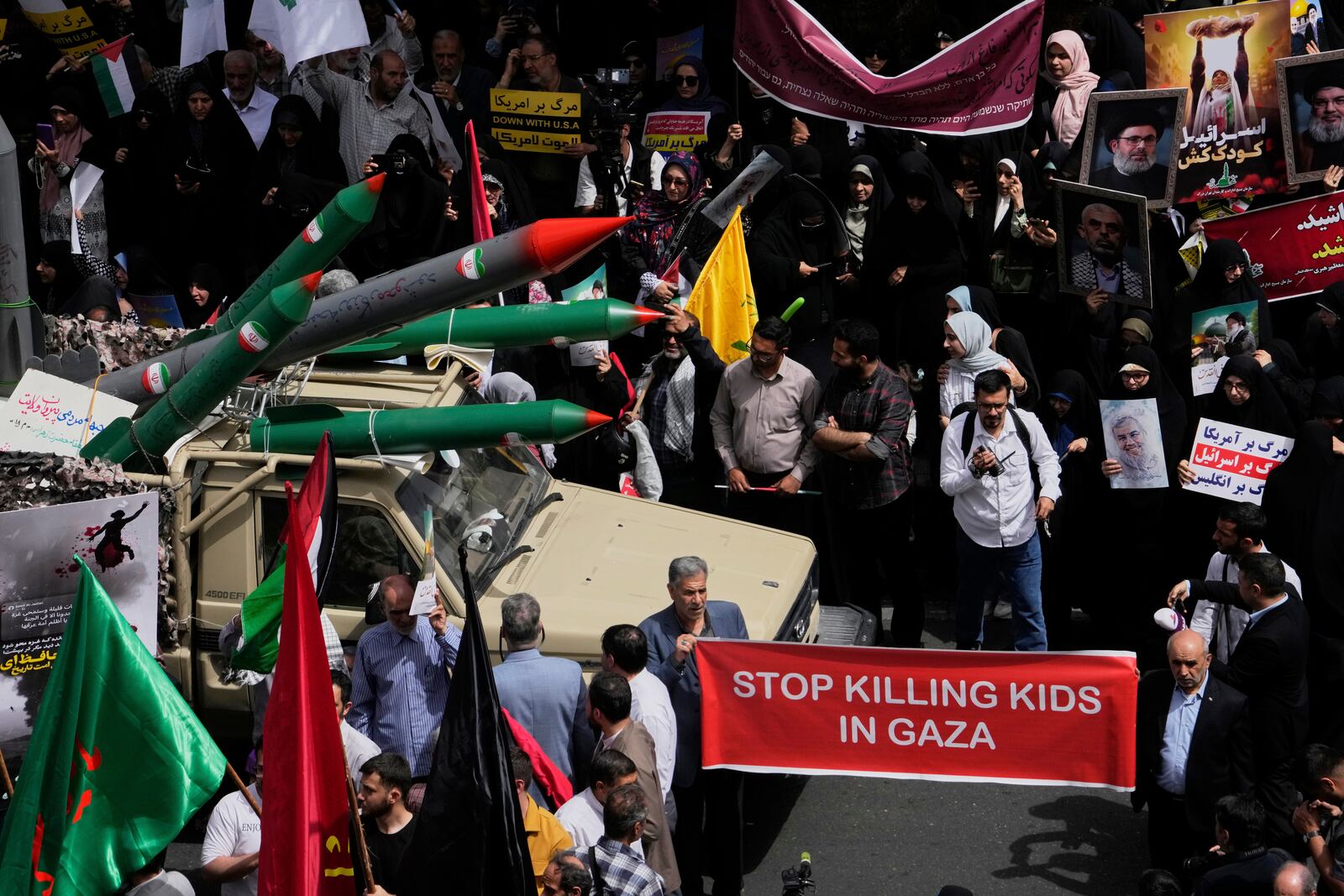 Replicas of some missiles are carried on a truck during an anti-Israel demonstration at the Felestin (Palestine) Sq. in Tehran, Iran, Wednesday, April 9, 2025. (AP Photo/Vahid Salemi)