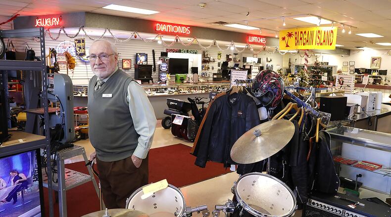 Larry Beloff, owner of Max’s Loan and Jewelers, stands in the showroom among all the different items they sell Thursday. Bill Lackey/Staff
