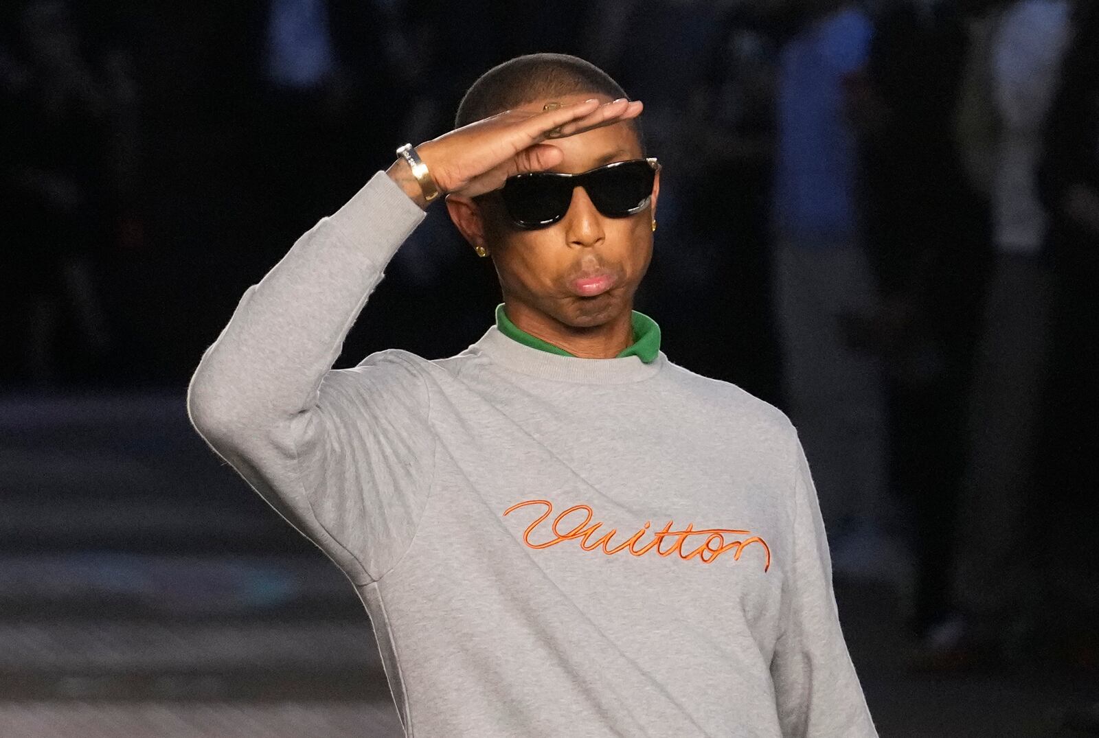 Designer Pharrell Williams takes the stage after the men's Louis Vuitton Spring-Summer 2026 collection, that was presented in Paris, Tuesday, June 24, 2025. (AP Photo/Michel Euler)