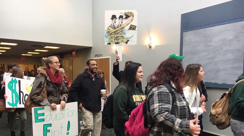 FILE: Wright State University students protested on Friday, April 7, 2017, before officials announced it will begin immediately cutting expenses campus wide to meets its goal of $25 million reduction goal. Students held signs, such as Release the Audit and Cut Administration Not Education, critical of the decisions. JOSH SWEIGART / STAFF