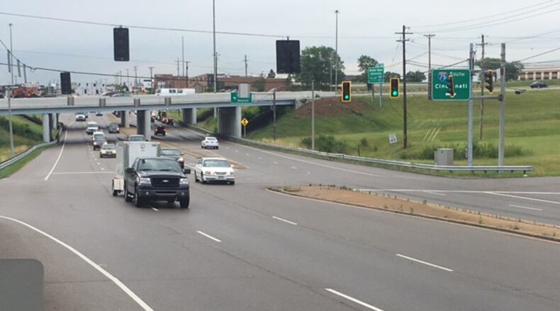 Miamisburg and Miami Twp. officials are considering hiring a landscaping firm to improve the aesthetics of the Ohio 725/Interstate 75 interchange. NICK BLIZZARD/STAFF