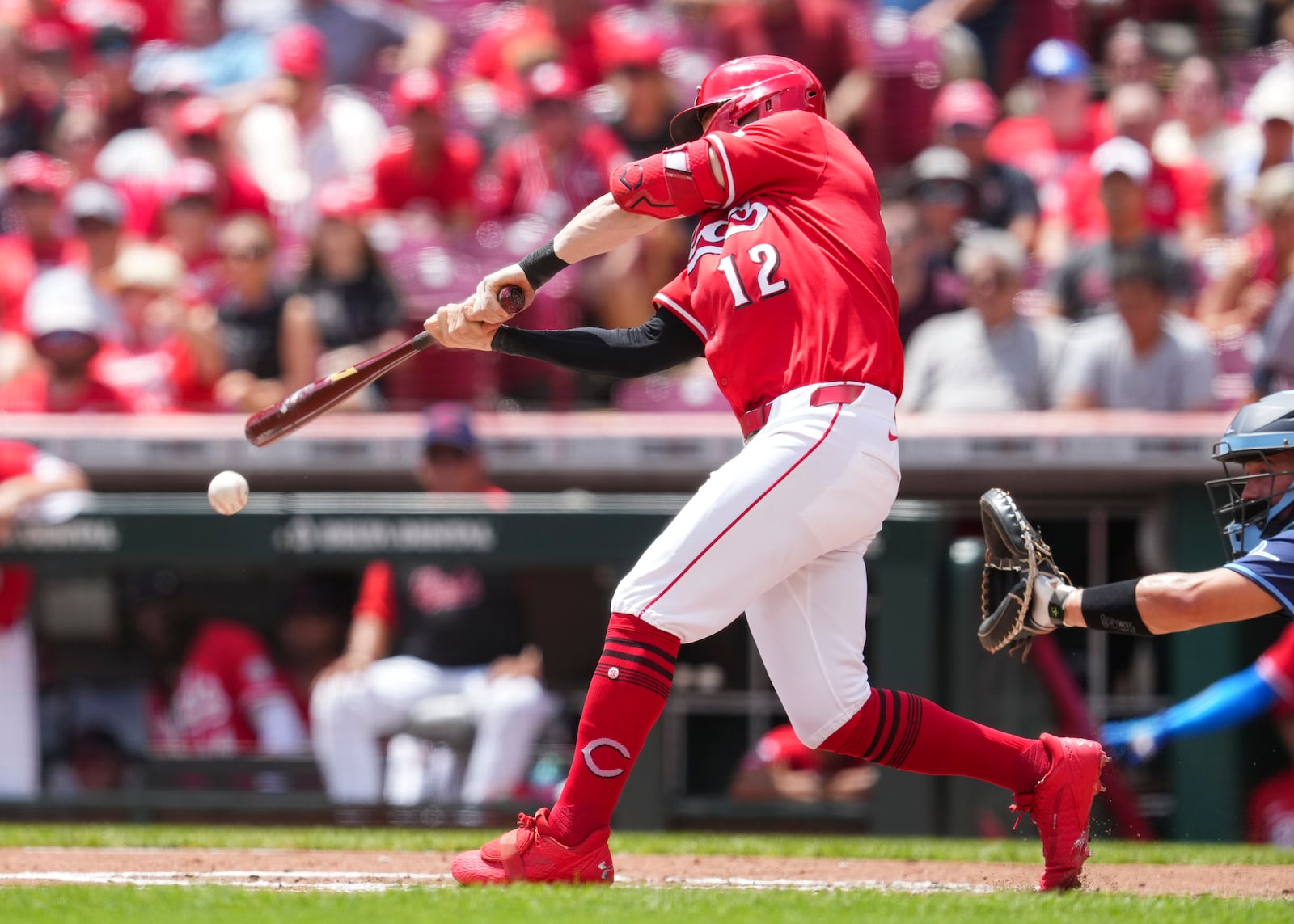 Cincinnati Reds' Austin Hays hits an RBI single during the first inning of a baseball game against the Tampa Bay Rays, Sunday, July 27, 2025, in Cincinnati. (AP Photo/Jeff Dean)