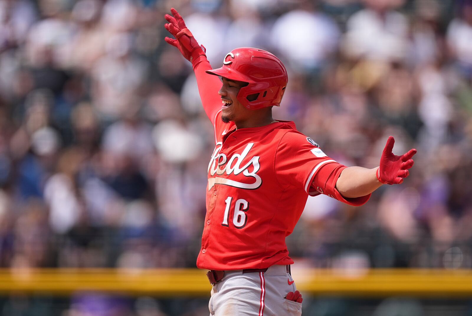 Cincinnati Reds' Noelvi Marte gestures to the dugout after hitting an RBI double off Colorado Rockies relief pitcher Jimmy Herget in the fifth inning of a baseball game Sunday, April 27, 2025, in Denver. (AP Photo/David Zalubowski)