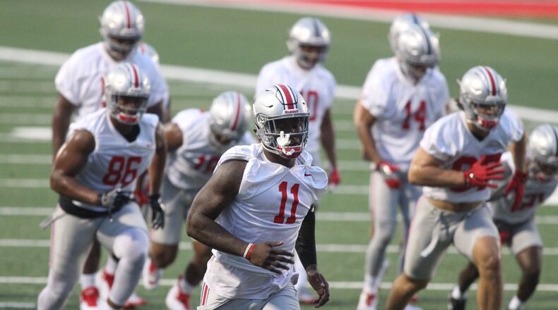Ohio State’s Jalyn Holmes (11) practices on Thursday, July 27, 2017, at the Woody Hayes Athletic Center in Columbus. David Jablonski/Staff