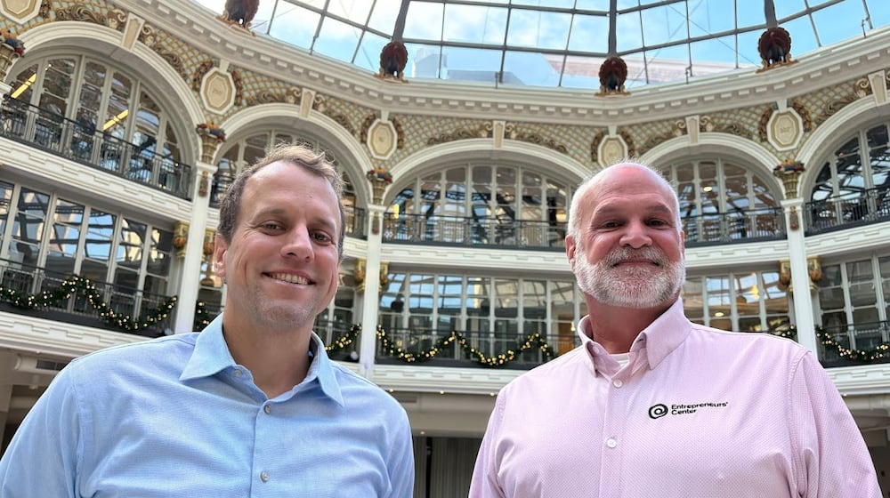 From left, Mike McCann, chief operating officer of The Entrepreneurs Center, with Scott Koorndyk, president of the center, at the downtown Dayton Arcade, on Dec. 4, 2025. THOMAS GNAU/STAFF