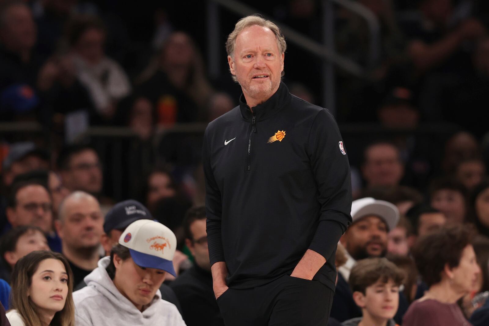 Phoenix Suns' head coach Mike Budenholzer stands on the court during the first half of an NBA basketball game against the New York Knicks, Sunday, April 6, 2025, in New York. (AP Photo/Pamela Smith)