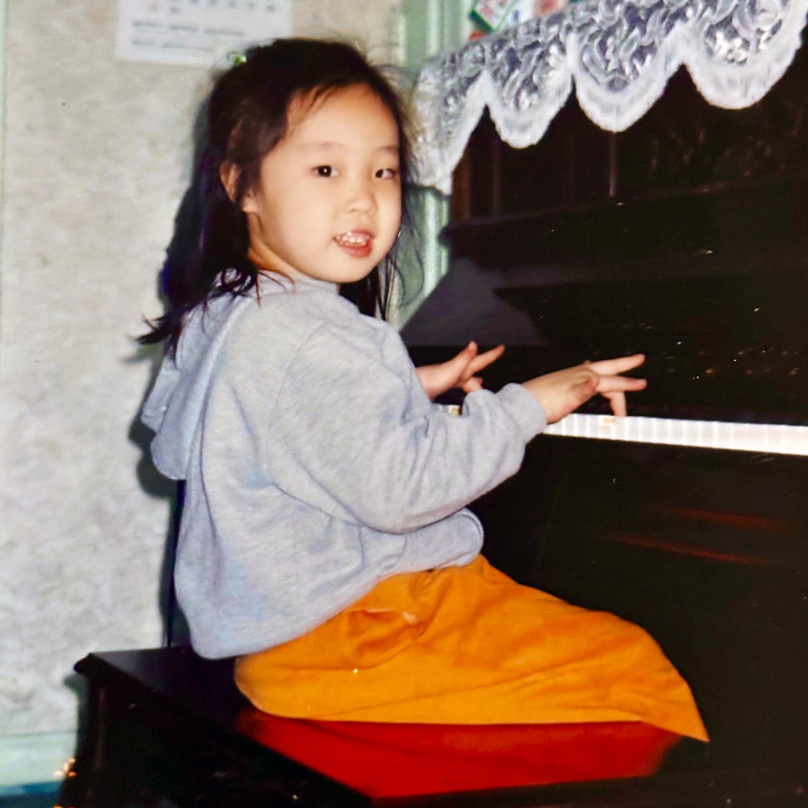 Serin OH as a five year old playing piano at her grandparents' house in Korea. Her family would move to the Dayton area the next year in 2003. CONTRIBUTED