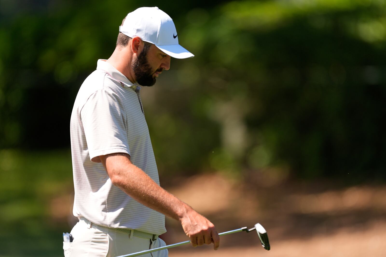 Scottie Scheffler walks the fairway of the eighth hole during the first round of the RBC Heritage golf tournament, Thursday, April 17, 2025, in Hilton Head Island, S.C. (AP Photo/Mike Stewart)