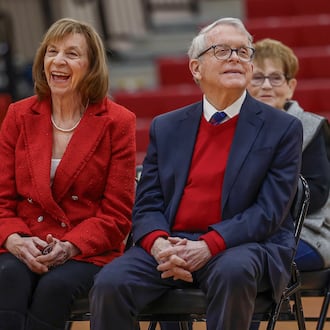 Tiffany Ways, left, chief school health officer of Health Partners of Western Ohio, First Lady Fran DeWine, center, and Ohio Gov. Mike DeWine share laughs as a speaker talks to students and teachers about the new children's eyesight program, OhioSEE, at Northeastern Elementary School on Monday, Feb. 9, 2026, in South Vienna. JOSEPH COOKE/STAFF