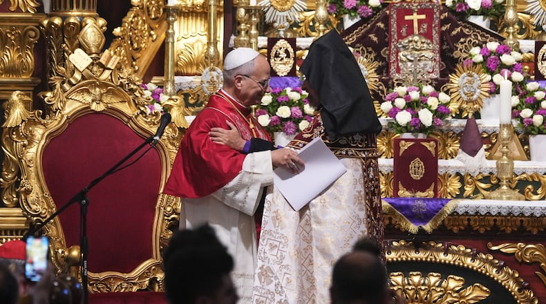 Pope Leo XIV and the Armenian Patriarch of Constantinople Archbishop Sahag II Mashalian celebrate a liturgy in the Armenian Apostolic Cathedral of Istanbul, Turkey, Sunday, Nov. 30, 2025. (AP Photo/Domenico Stinellis)