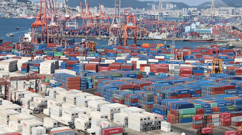 Cranes and shipping containers are seen at a port in Busan, South Korea, Thursday, July 31, 2025. (Gang Seon-bae/Yonhap via AP)
