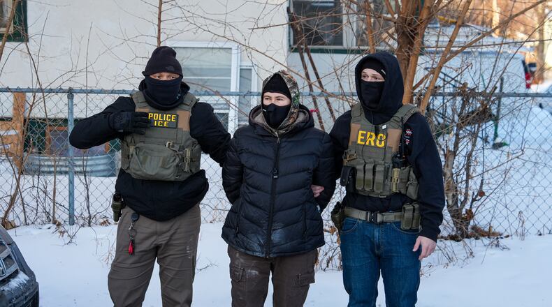 An activist is detained by federal agents on Tuesday, Feb. 3, 2026, in Minneapolis. (AP Photo/Ryan Murphy)