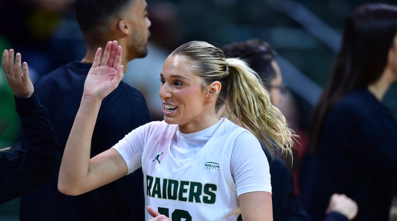 Wright State's Alexis Hutchison is congratulated after Thursday's Horizon League quarterfinal game vs. Milwaukee at the Nutter Center. Joe Craven/Wright State Athletics