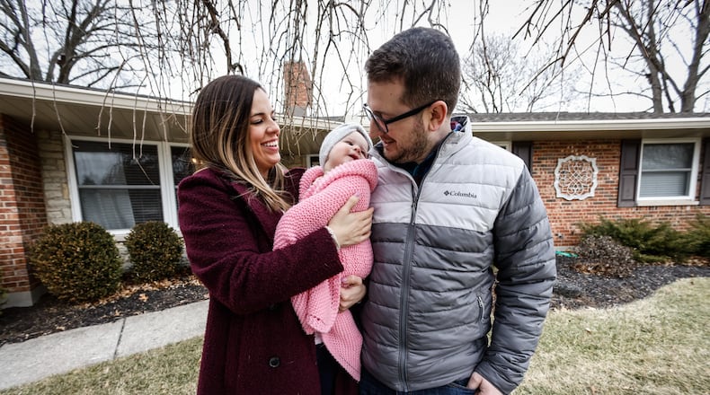 Steve and Kaitlen Gerace and their daughter, Gemma bought their house in Kettering four months ago. The couple said it is a challenge to find a home in Dayton's sellers'  market, but added equity in the house they sold. JIM NOELKER/STAFF