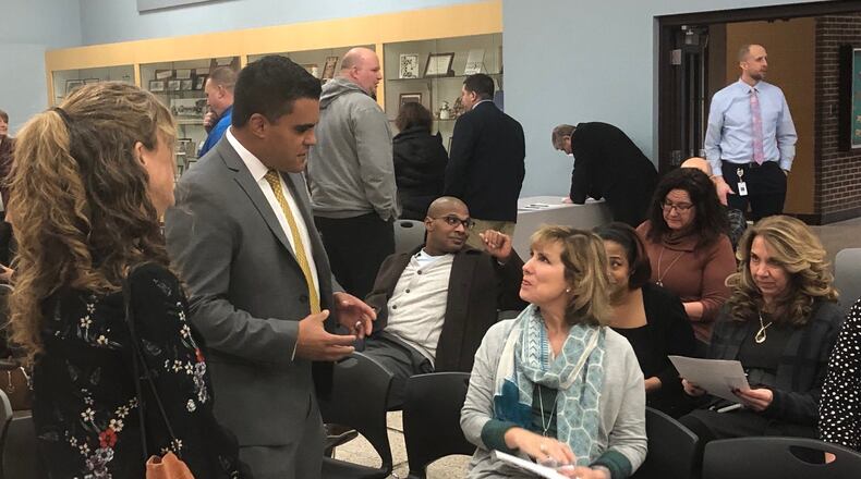 Mario Basora talks to Huber Heights teachers and residents Feb. 19, 2019 at the meeting where Huber Heights’ school board hired Basora as superintendent, effective summer 2019. Basora has been the superintendent of Yellow Springs schools for several years. JEREMY P. KELLEY / STAFF