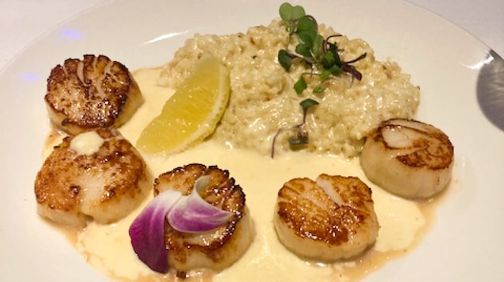 Scallops with risotto and asiago butter at Club Oceano at The Greene, Beavercreek. RAY MARCANO/CONTRIBUTED