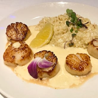 Scallops with risotto and asiago butter at Club Oceano at The Greene, Beavercreek. RAY MARCANO/CONTRIBUTED