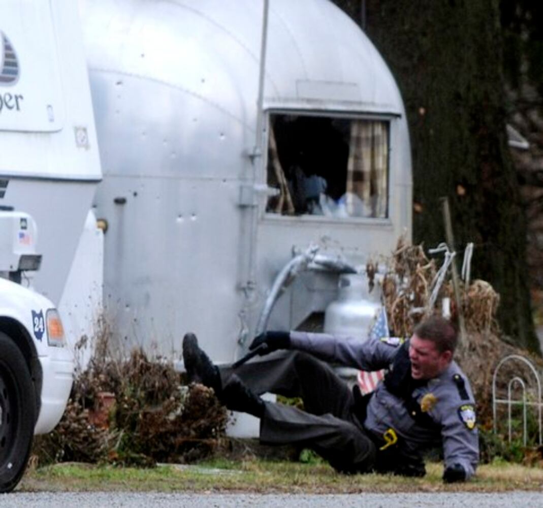 Patrolman shot at Enon Beach