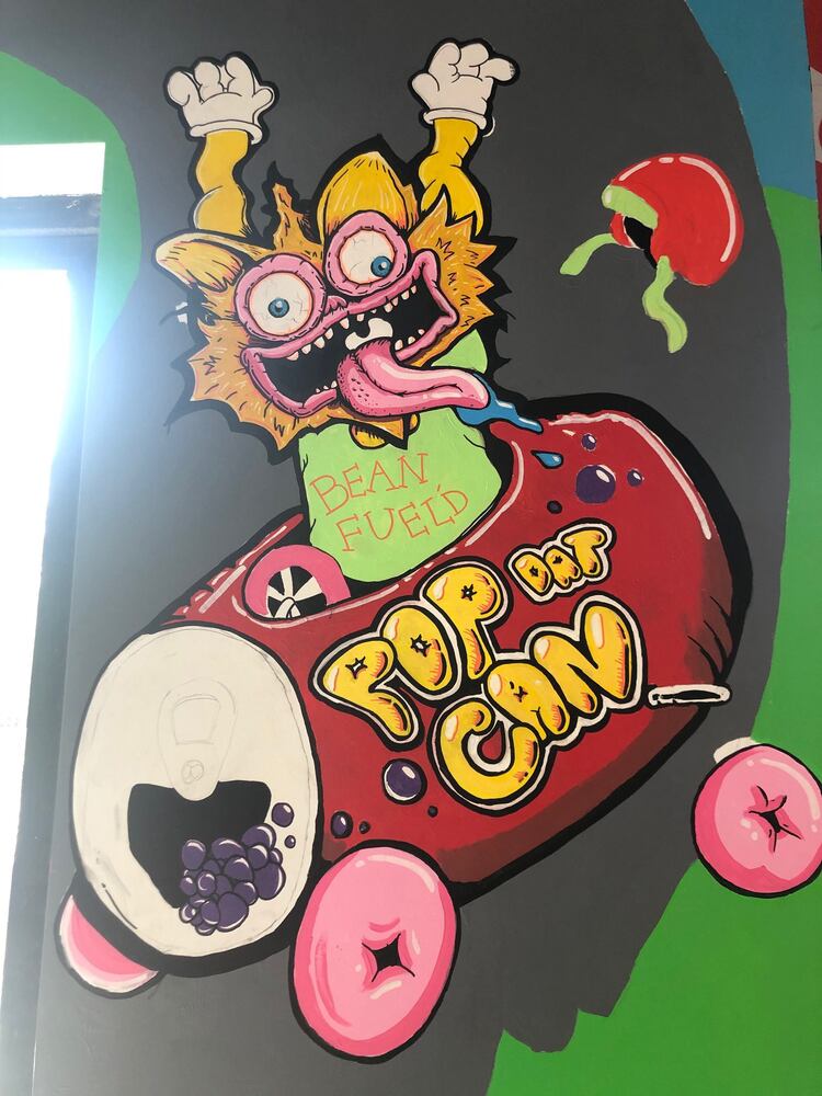 PHOTOS: Wild and wacky murals take over new restaurant at The Greene