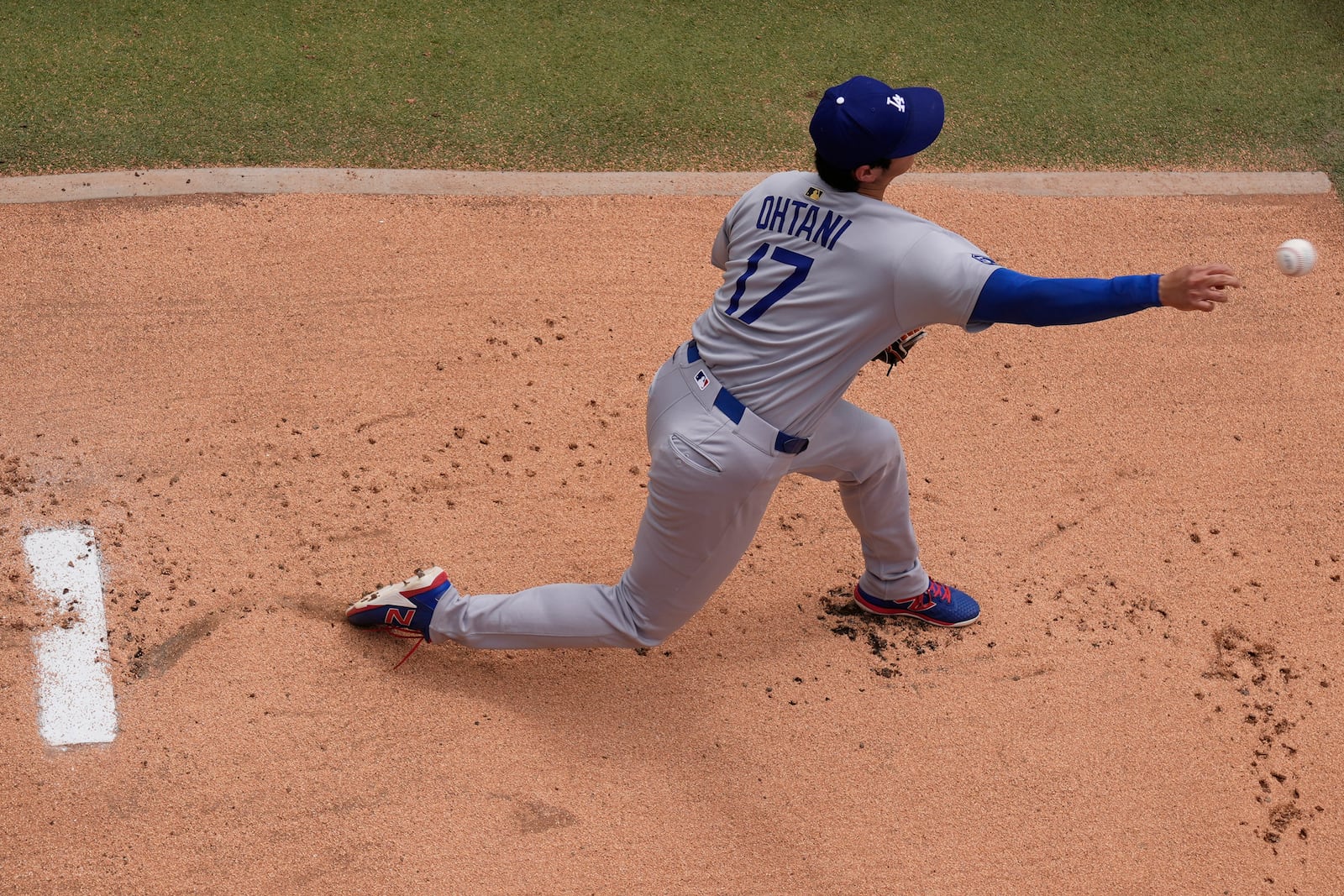 Los Angeles Dodgers starting pitcher Shohei Ohtani warms up before a baseball game against the Kansas City Royals, Saturday, June 28, 2025, in Kansas City, Mo. (AP Photo/Charlie Riedel)