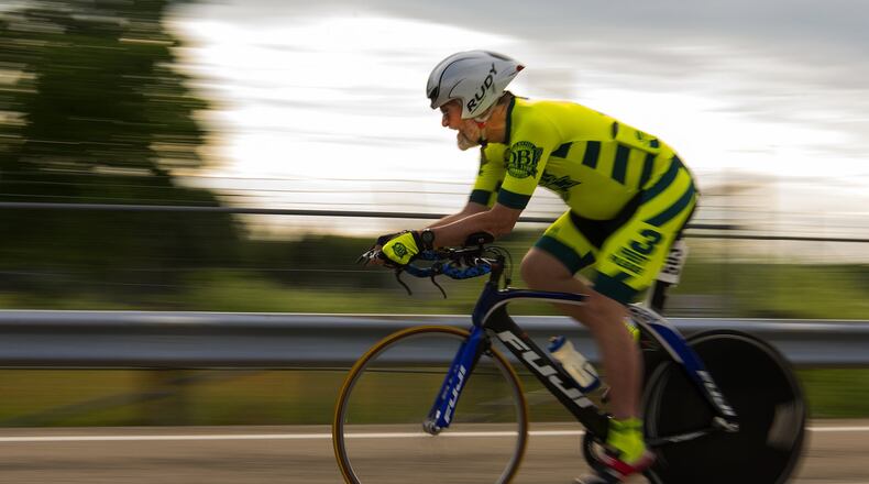 Chuck Smith, Team Dayton, approaches the first turn of the Blue Streak Time Trial on Wright-Patterson Air Force Base, Ohio, June 9. The Blue Streak Time Trials, held the second Tuesday of every month from April through October, cover a 10-mile course on the base. (U.S. Air Force photo by R.J. Oriez)