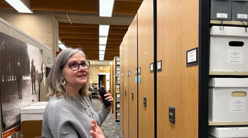 Toni Vanden Bos, head of special collections and archives at Wright State University, shows off part of the university's massive collection of artifacts related to the Wright brothers on Friday, Jan. 30, 2026 at the university's Dunbar Library. THOMAS GNAU/STAFF