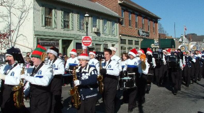 More than 60 groups - including the Miamisburg High School Marching Band - are set to be part of the city’s holiday parade Saturday. FILE PHOTO